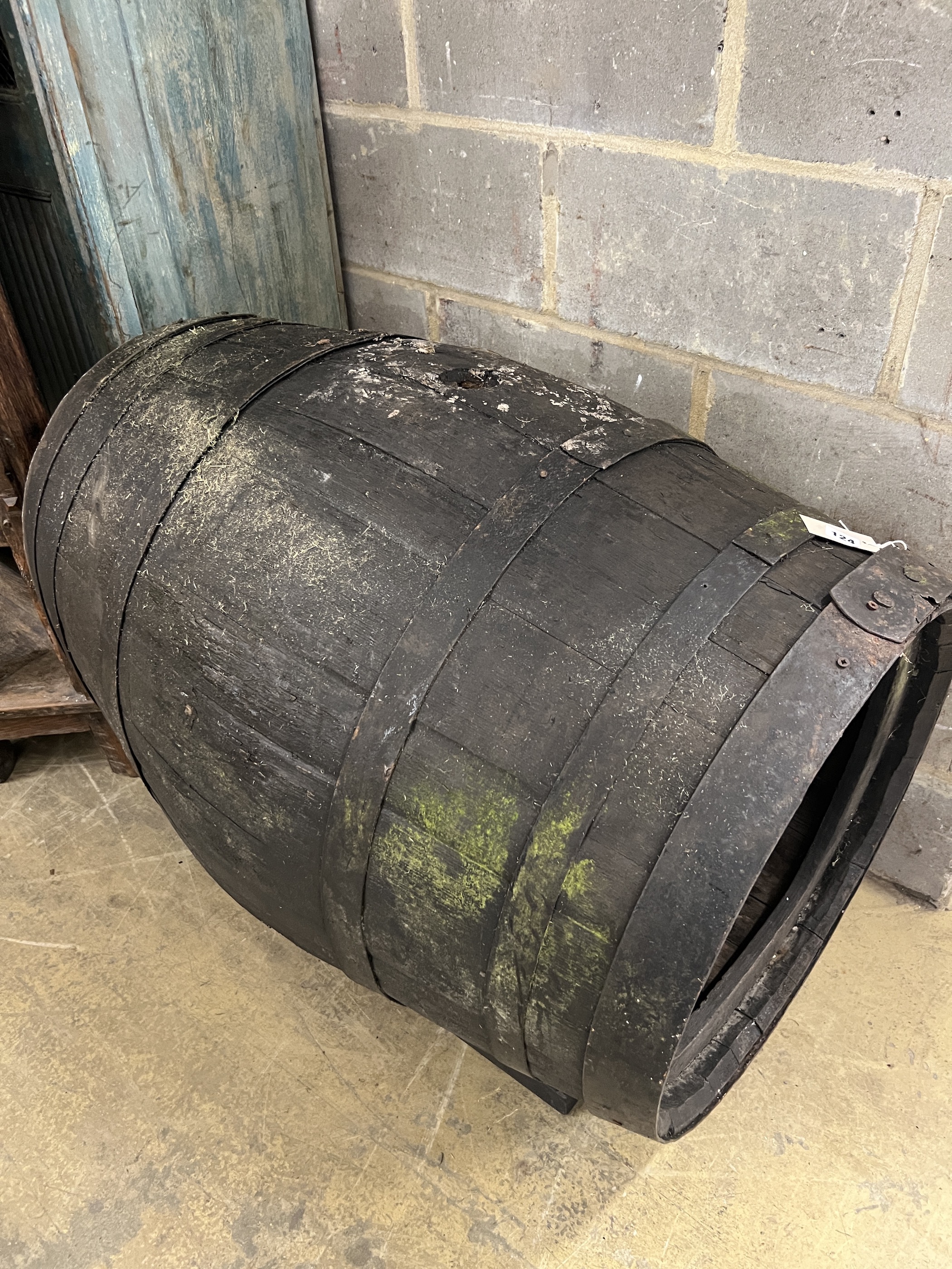 A vintage coopered wine barrel on stand, now converted to a dog's kennel, width 96cm, height 76cm